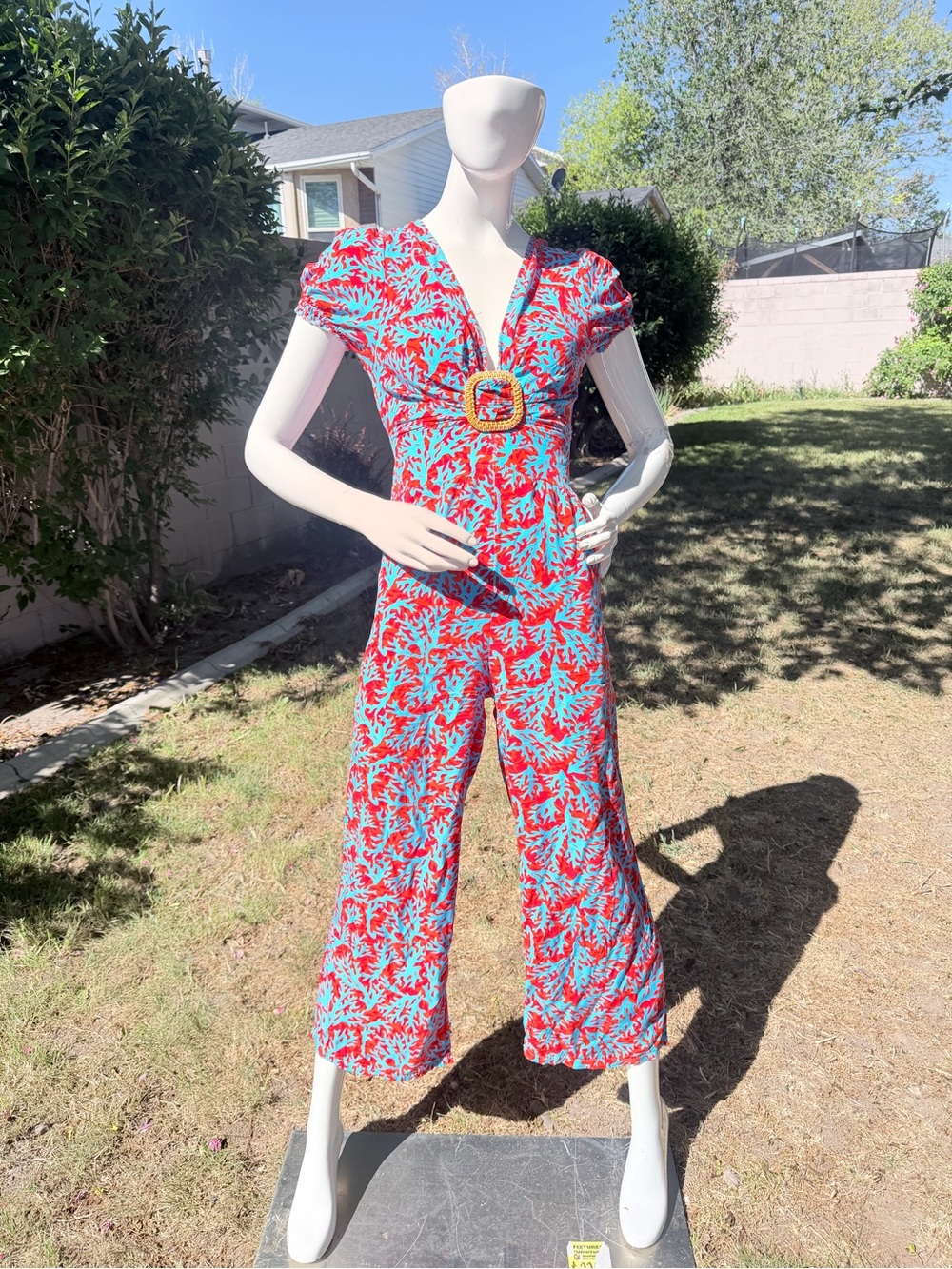 bucco Red & Blue Printed V-Neck Jumpsuit with Buckle Accent